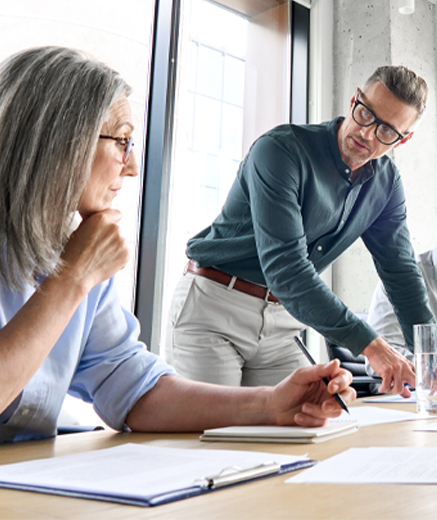 Image of coworkers discussing project.