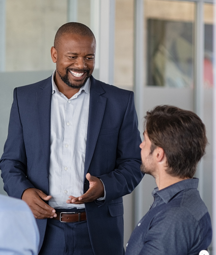 Image of man speaking to client.