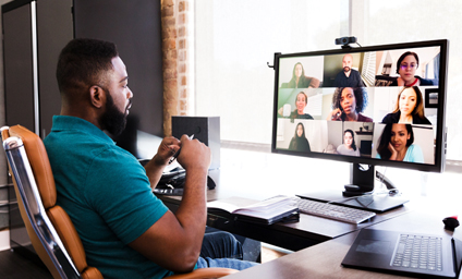 Image of man participating in video meeting.