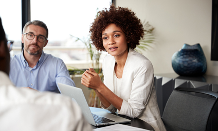 Image of female coworker leading meeting.